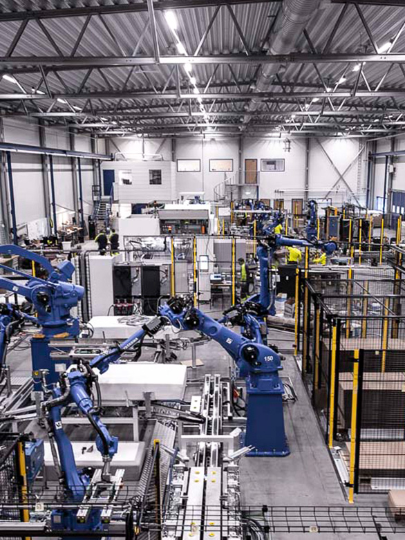 Fixed automation machinery with guarded entry and exit points to reduce risks from moving goods